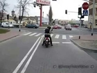 Mad motorcycle rider with axe on red traffic lights!