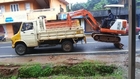 Loading an excavator onto a truck This happened in Pathanamthitta, India on 14th July 2014.