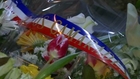 Parisians lay flowers at scene of deadly attack on Charlie Hebdo headquarters