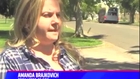 Woman 'walks' dog on leash out car window