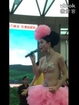 Woman with transparent bras sings to promote sales in store