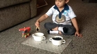 2 year old Child Moksh likes a Montessori Scooping Activity: Toddler Life Skills