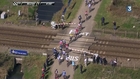 A Train blocks the Cycling race Paris-Roubaix 2015